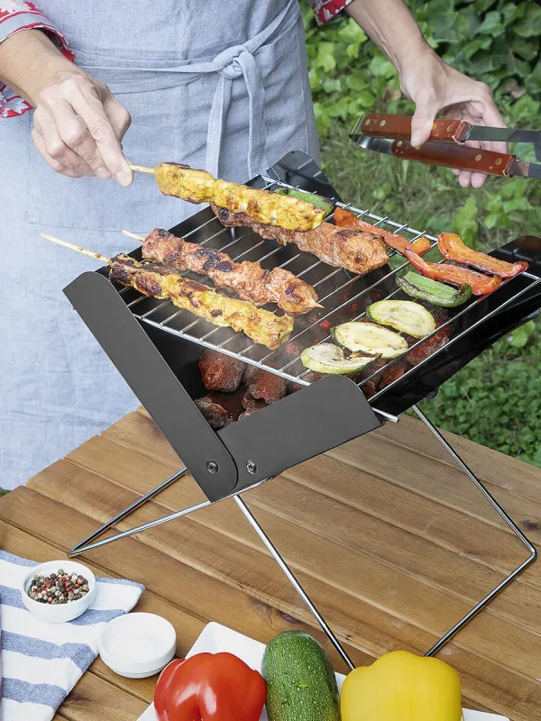 Produkt Přenosný skládací minigril na dřevěné uhlí Foldecue InnovaGoods Obrázek
